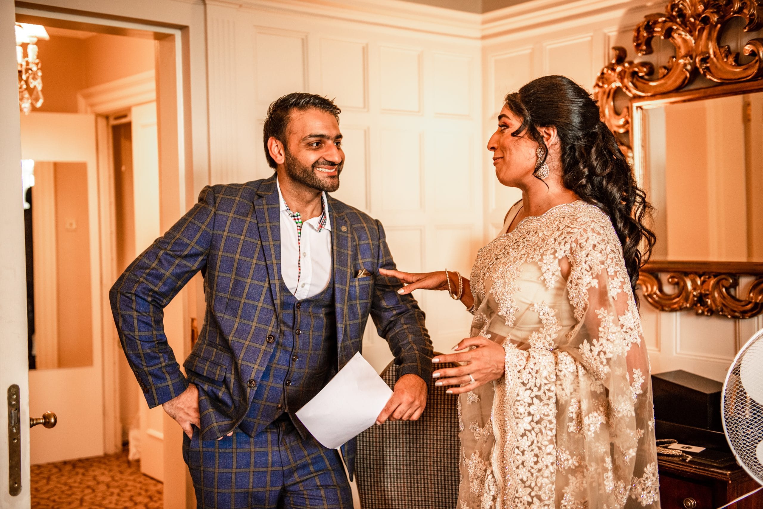 Asian wedding planner assisting a couple during their wedding consultation – Mr Flavour UK