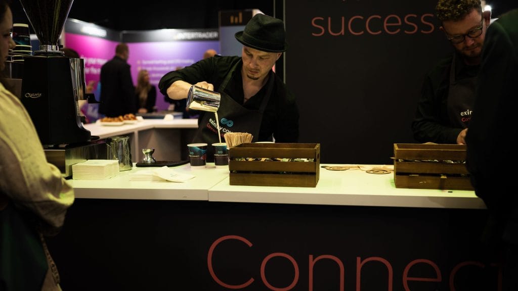 barista creating coffee at an expo trade show