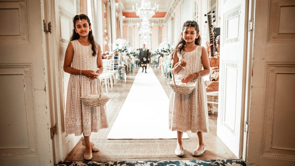 image of flower girls at the start of a wedding walkway