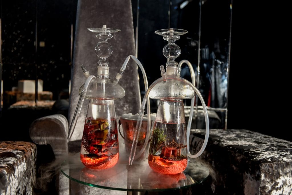 Luxury shisha hire setup with premium glass shisha pipes and LED lighting at a private event