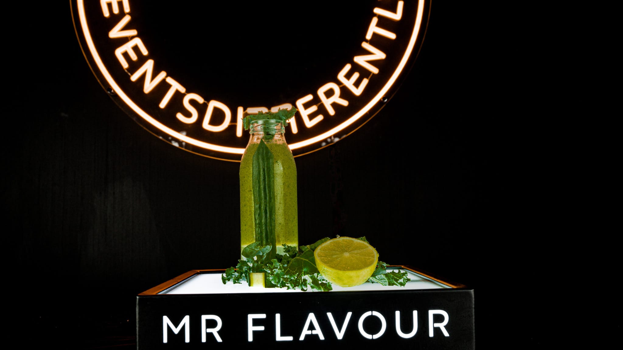 Green nutritious smoothie served at a branded smoothie bar hire setup for corporate events and exhibitions.