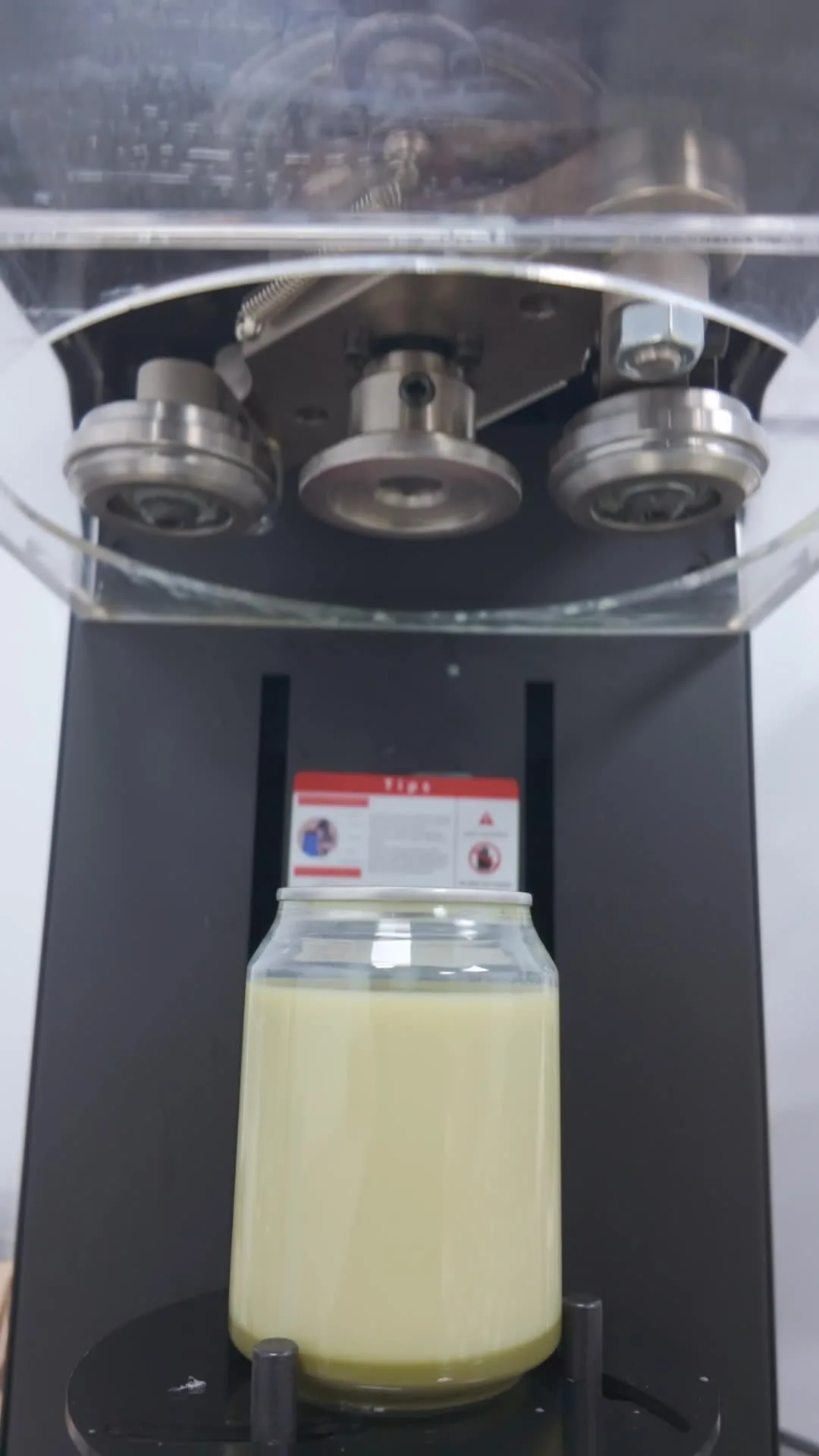 A 250ml iced matcha can being sealed on the canning machine in the Mr Flavour production kitchen