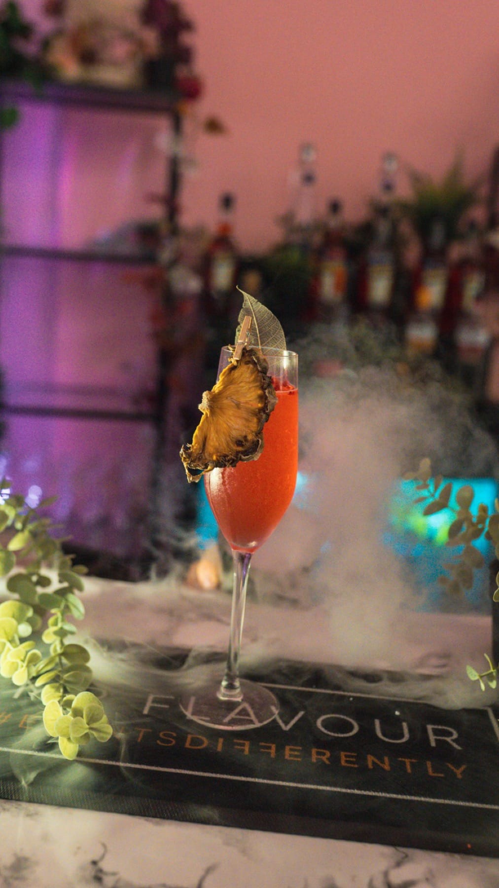 Pink P.Louise branded cocktail at a Mr Flavour event