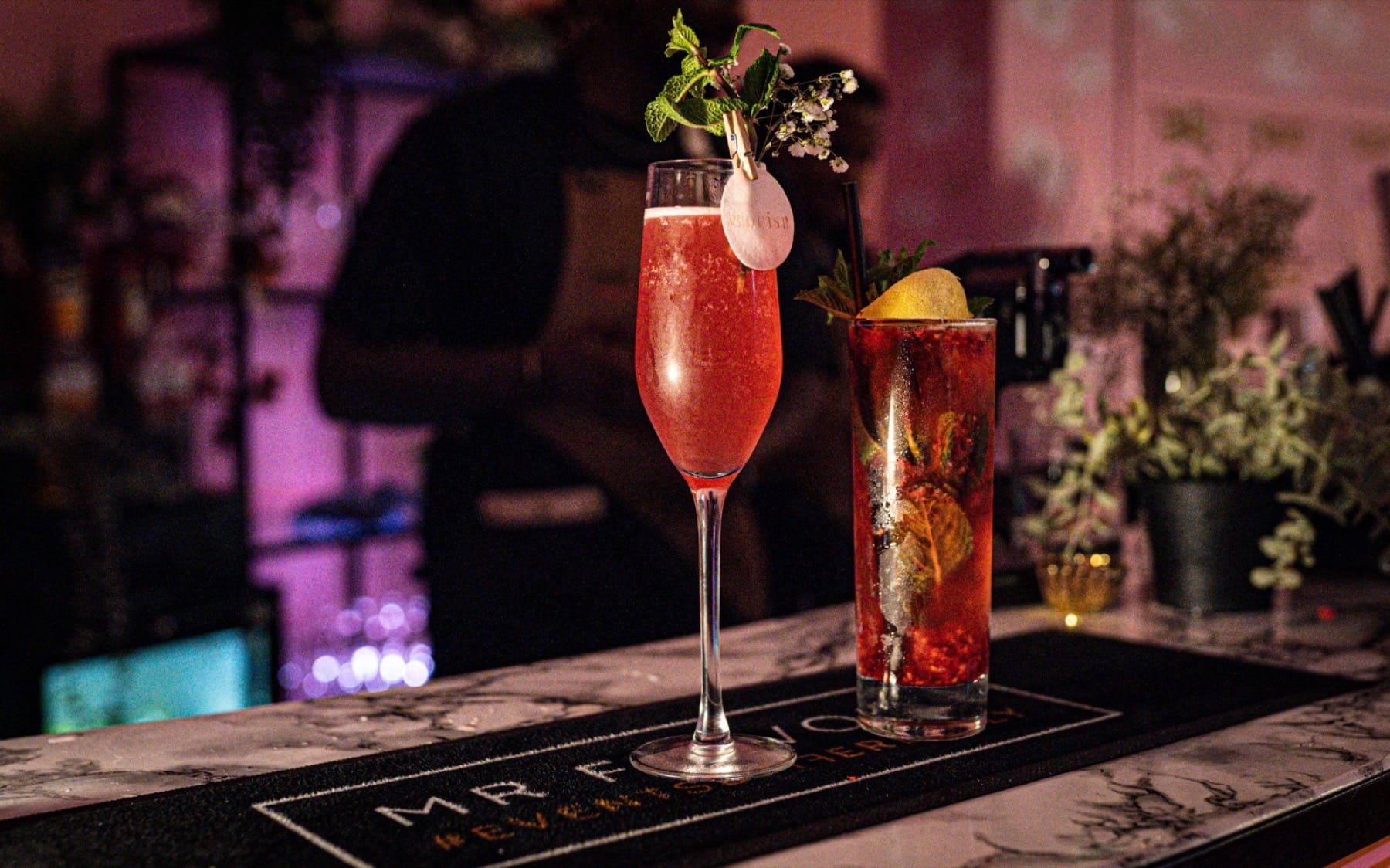 Pink and berry P.Louise branded cocktails on a Mr Flavour bar