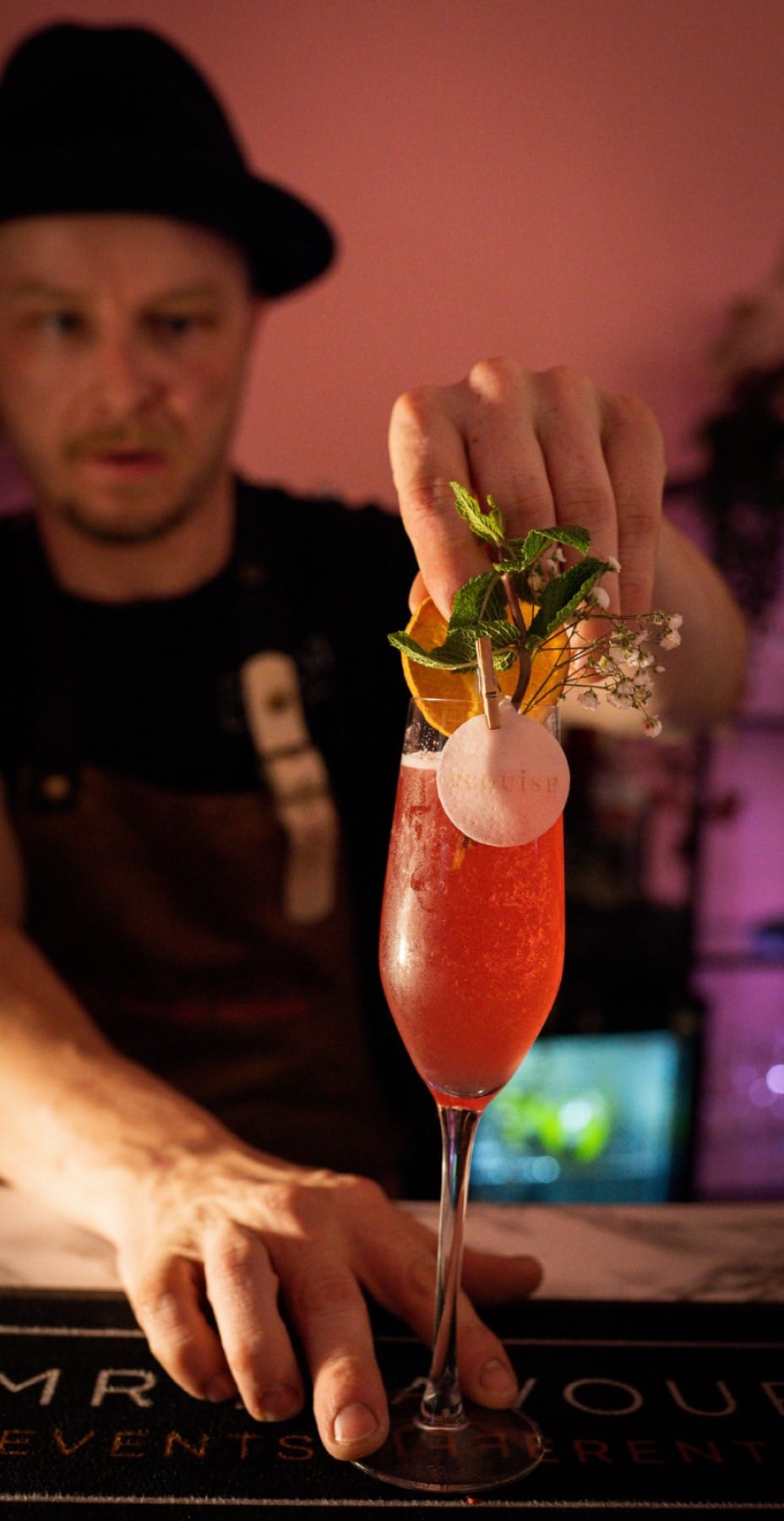 P.Louise branded cocktail with garnish