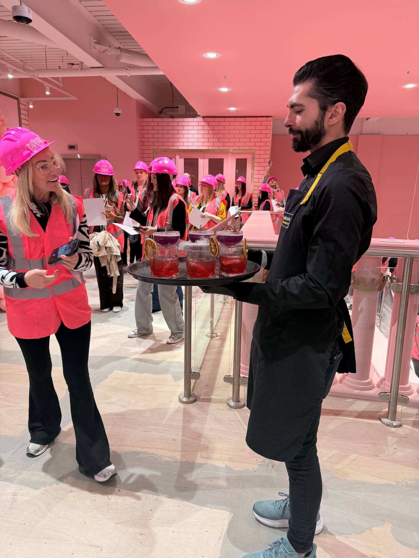 Mr Flavour serving pink drinks to guests at the P.Louise Trafford Palazzo launch