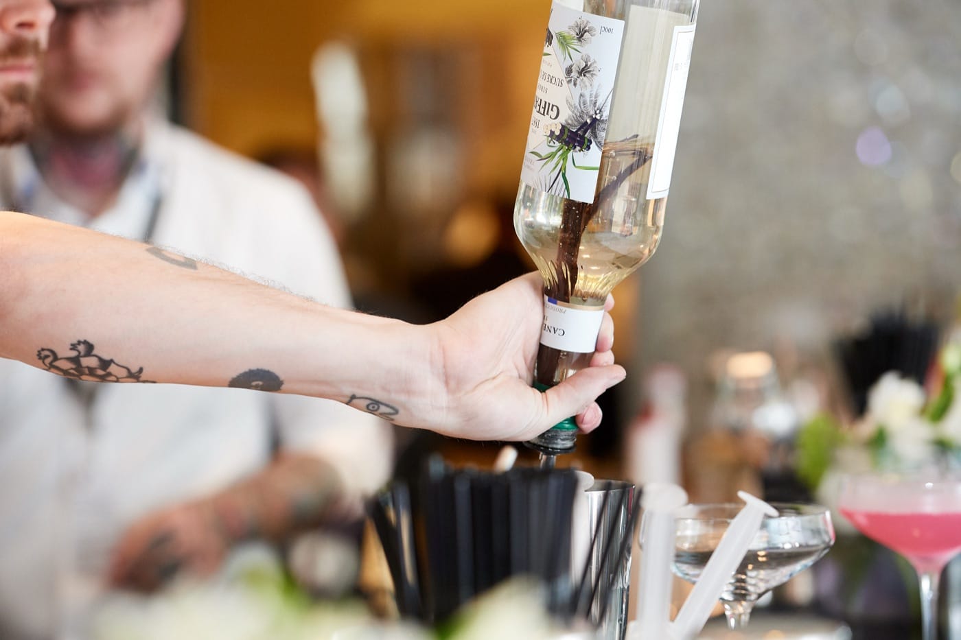 Mr Flavour bartender building a fresh cocktail at a Yas Marina suite bar during the Abu Dhabi Grand Prix