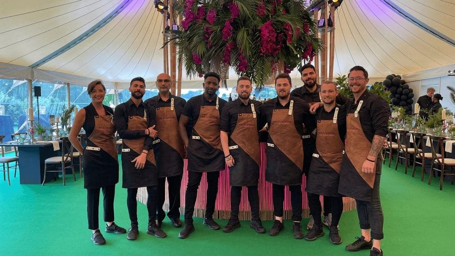 The Mr Flavour floor team lined up in front of a marquee bar before doors